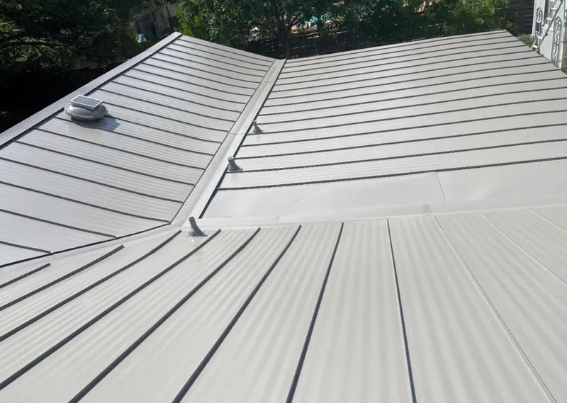 Solar attic fan installed on a metal roof for Roof Ventilation in Homer Glen